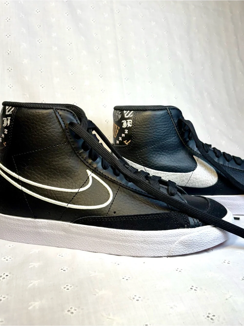 Nike Black High-Top Sneakers with White Tongue Text